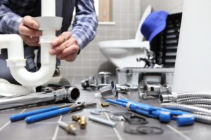 Our plumbing expert doing a drain repair in a bathroom in Toronto, ON
