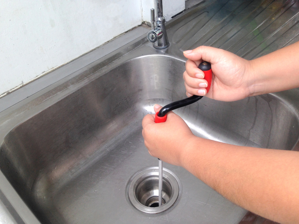 One of our plumbers doing a plumbing camera inspection on client's sink in Toronto, ON