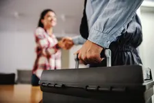 Homeowner shaking hands with plumber
