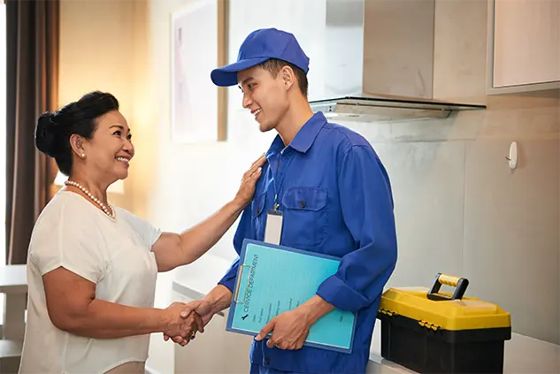 Shaking hands with a plumber.
