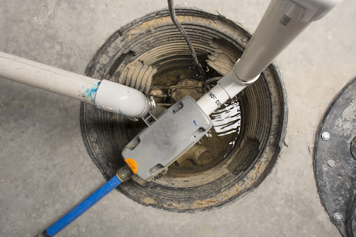 Open sump pump being worked in basement of Toronto, ON home.