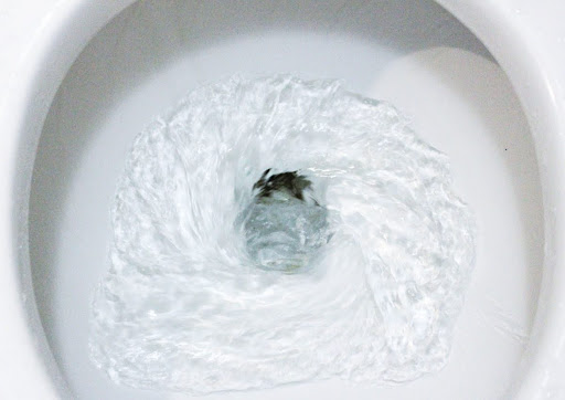 Close up view of toilet flushing