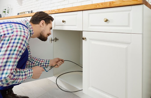 Priority Plumbing plumber drain cleaning kitchen sink.